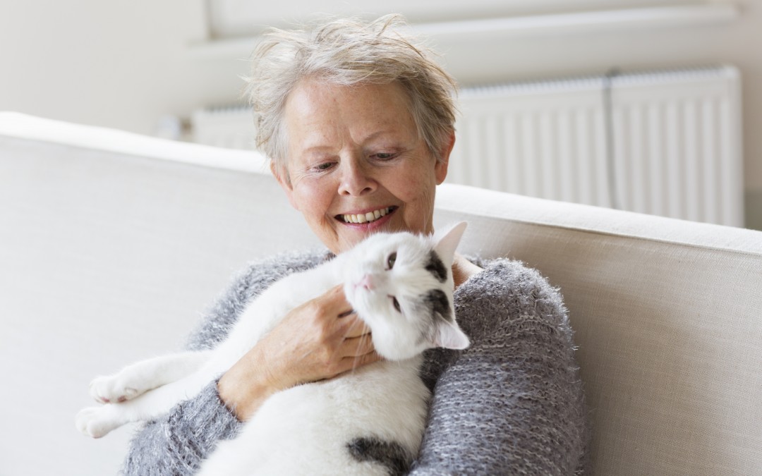 senior women happy with her cat